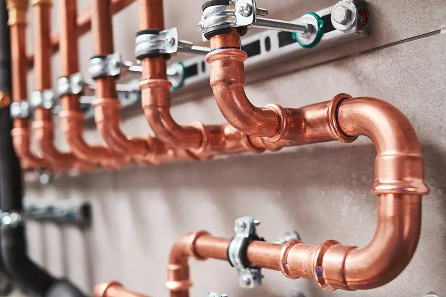 Commercial pipe fittings in a plumbing room